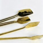 Pince de cuisine plat en inox doré